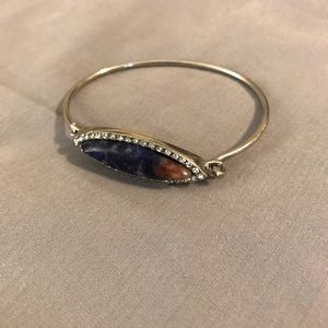 Silver bracelet with blue stone